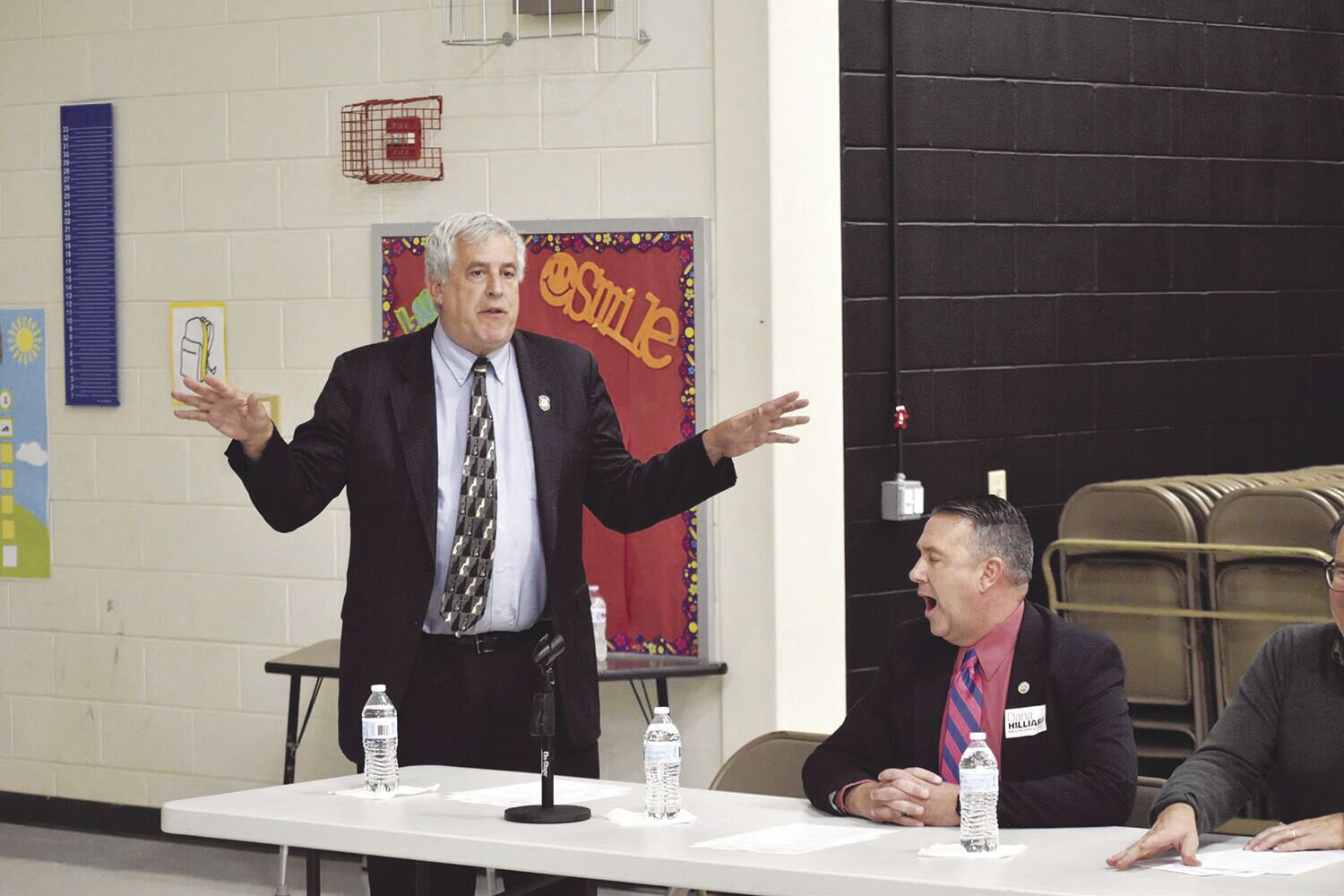 Kenney, Hilliard argue about will work harder